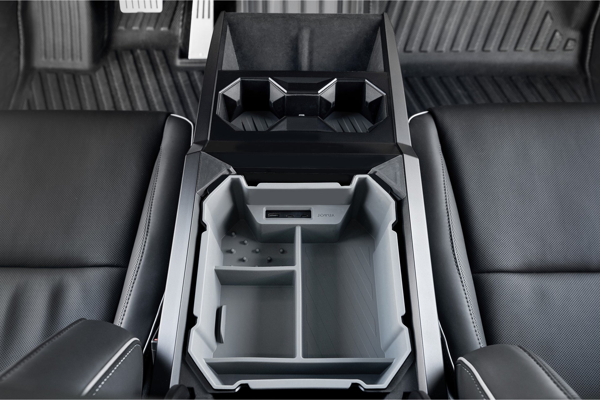 The image shows JOWUA's Center Console Set for the Tesla Cybertruck, featuring multiple sections including cup holders and a USB port. With black leather seats, this silicone-lined organizer blends sleek utility with modern design.