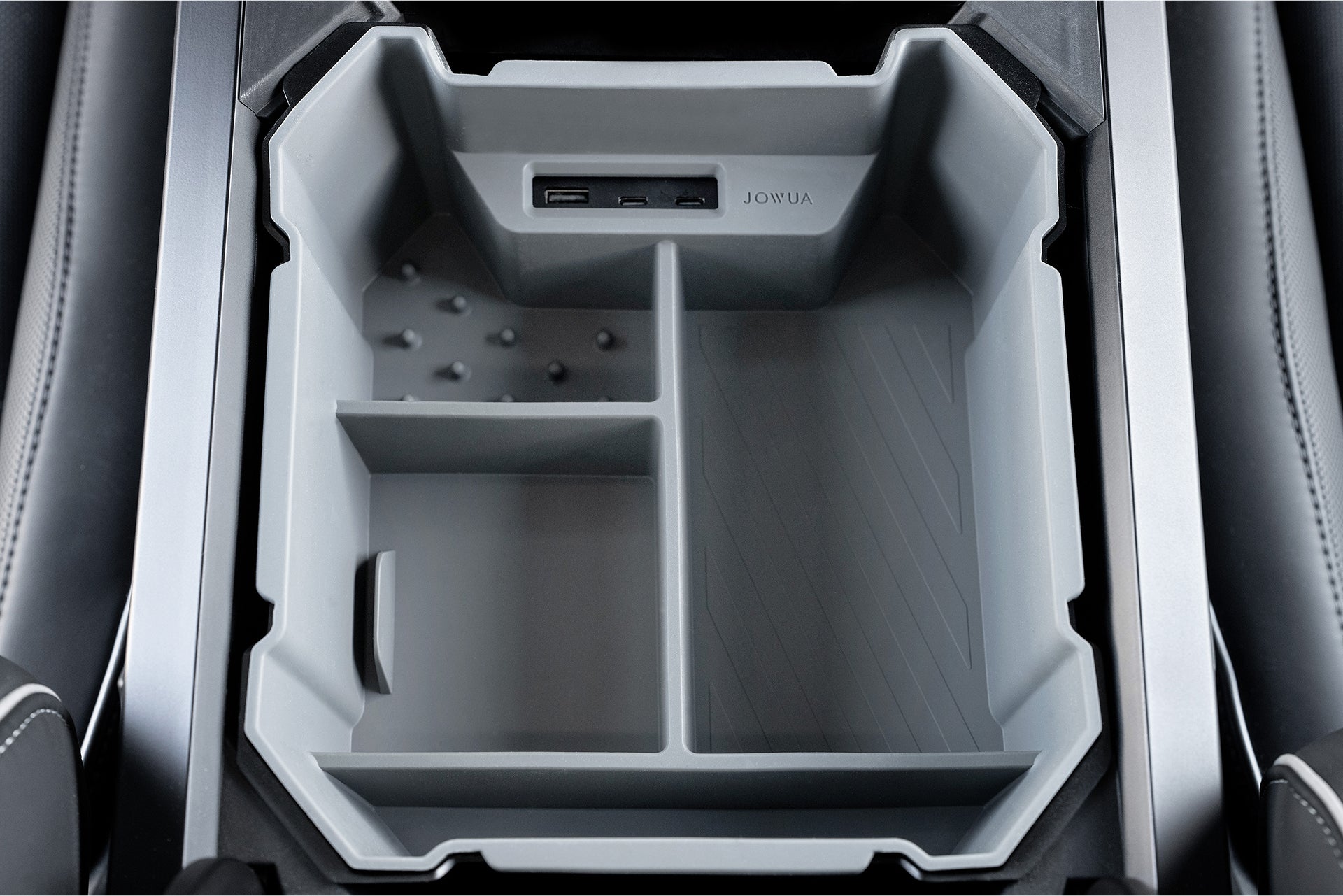 The JOWUA Center Console Set for the Tesla Cybertruck is a premium silicone organizer with three compartments, including one textured and another smooth for USB connections, perfect for optimizing your vehicle's interior and keeping essentials within reach.