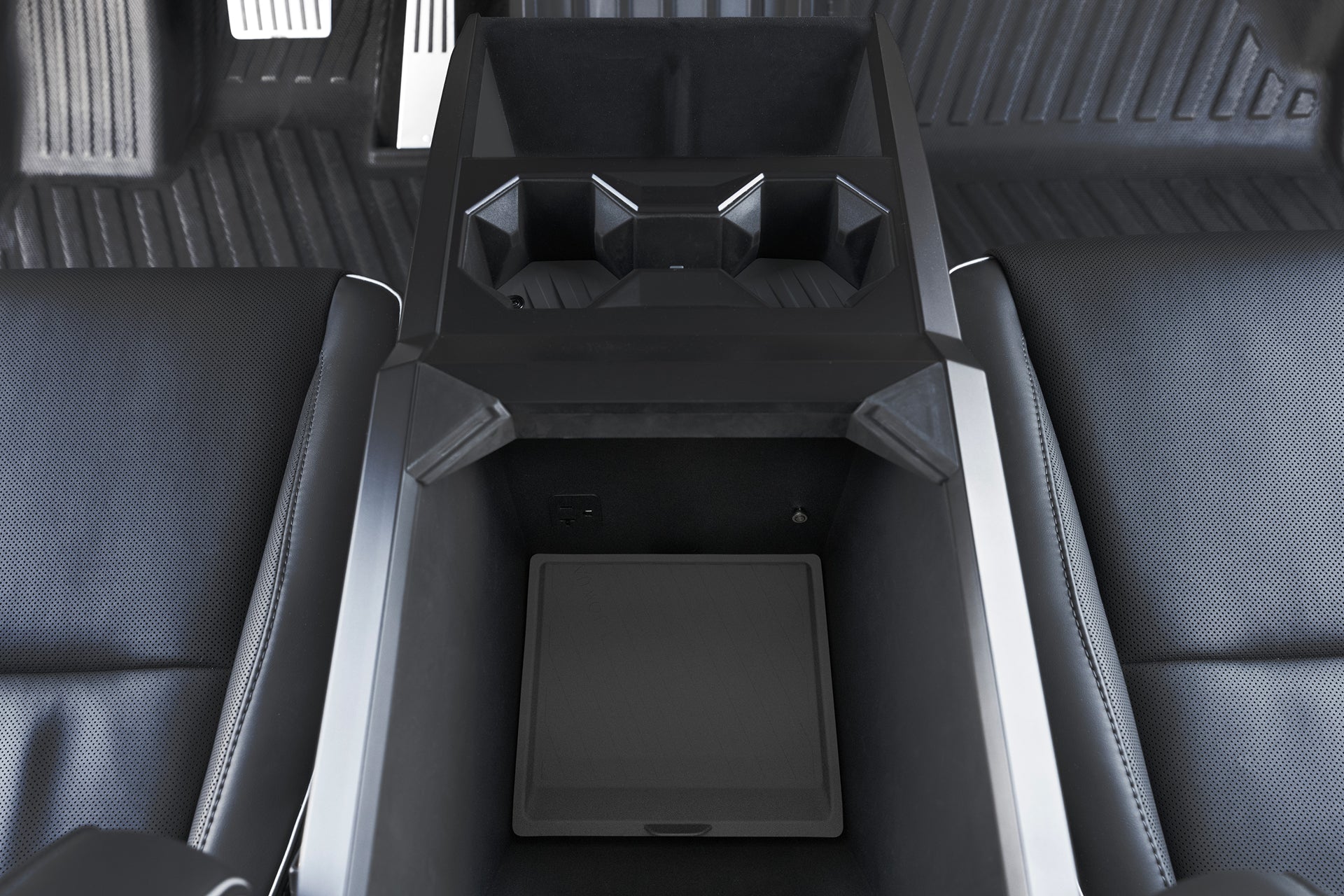 Discover JOWUA's Center Console Set for the Tesla Cybertruck, featuring a premium silicone-lined rectangular storage area, integrated cup holders, and sleek dark upholstery for a sophisticated look.