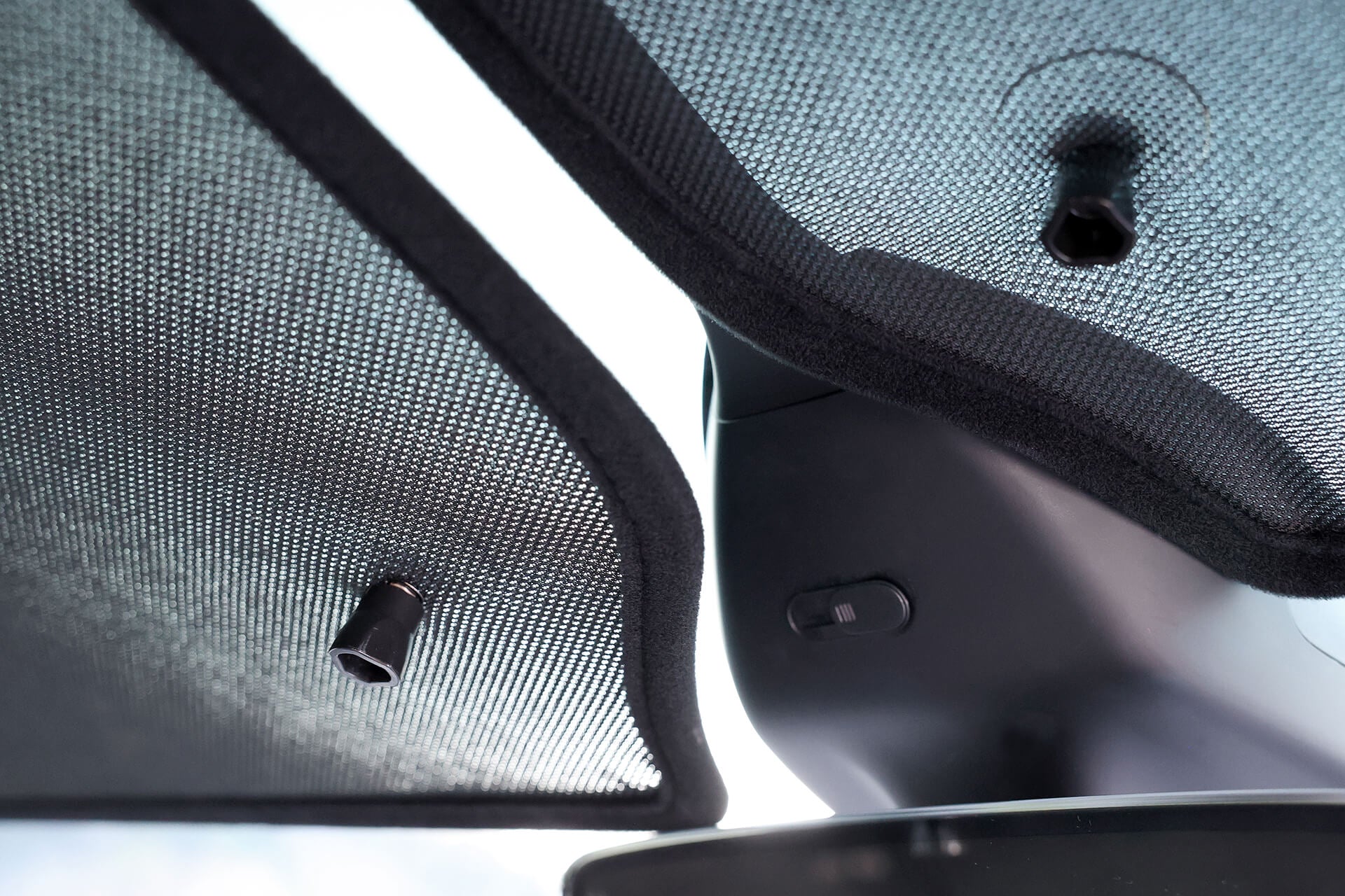 The JOWUA Glass Roof Sunshade-Mesh (Model X) features two mesh pieces with fasteners, offering UV protection and a hardware switch. The mesh lets some light through while boosting heat insulation.