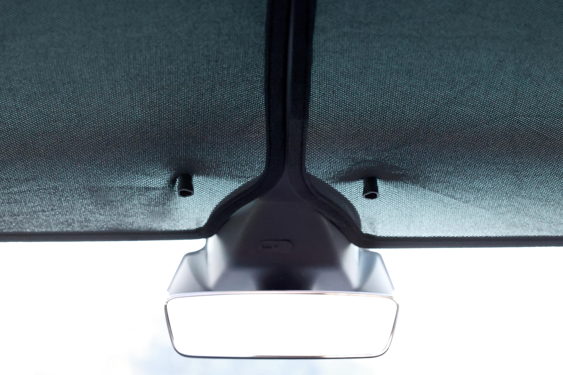 Interior view of a car's rearview mirror attached beneath a central console. Flanked by JOWUA's Glass Roof Sunshades (Model X), the design enhances UV protection and comfort with two dark sunshades partially covering the top of the windshield.