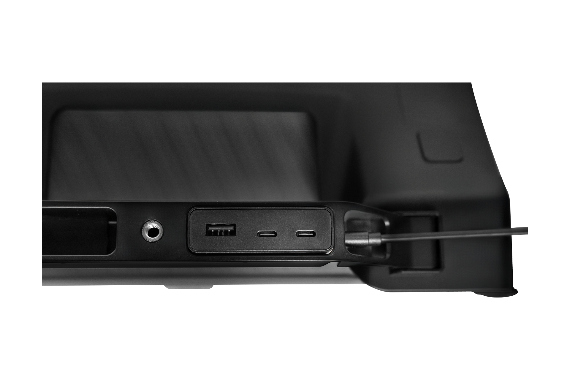 Close-up of JOWUA's Under Screen Invisible Station's back panel, showcasing a hidden array of ports: a USB port, two USB-C ports, an audio jack, and a lock slot. Its sleek, dark design matches the elegance of a Tesla Hub.