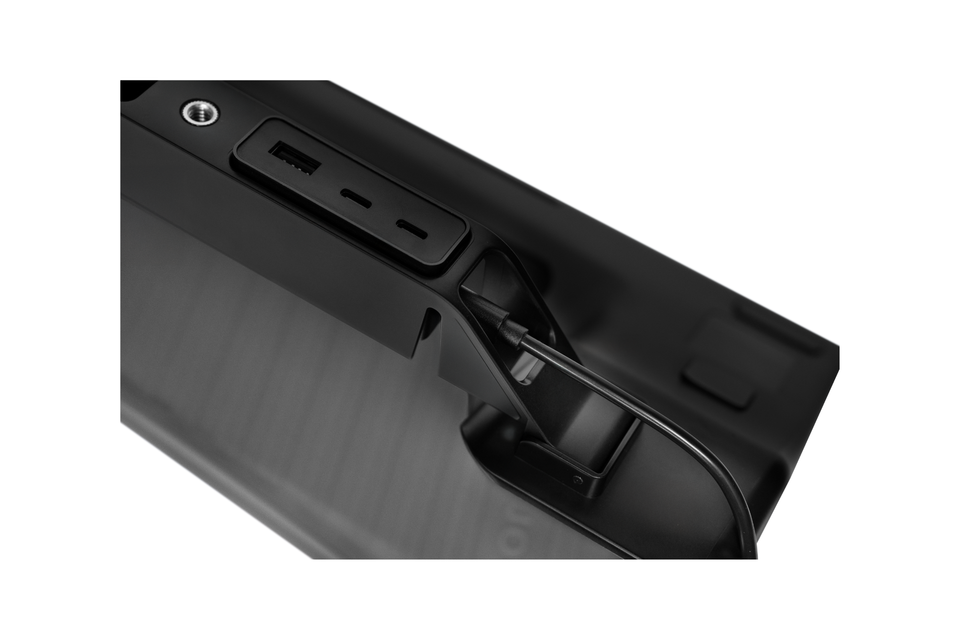 Close-up of JOWUA's Power HUB, a black electronic device with USB ports and a switch. Its sleek design showcases smooth surfaces and a modern finish, emphasizing its advanced USB-C power conversion capabilities.